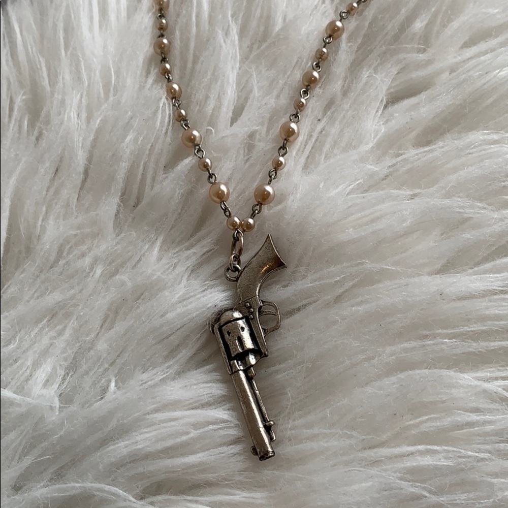Gun on pink pearl necklace